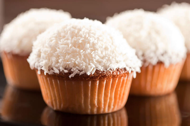 Sweet white cupcake with coconut and lemon
