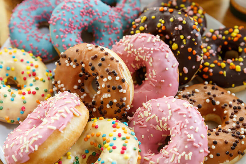 Set of fresh colorful donuts