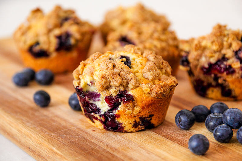 freshly baked blueberry muffins with an oat