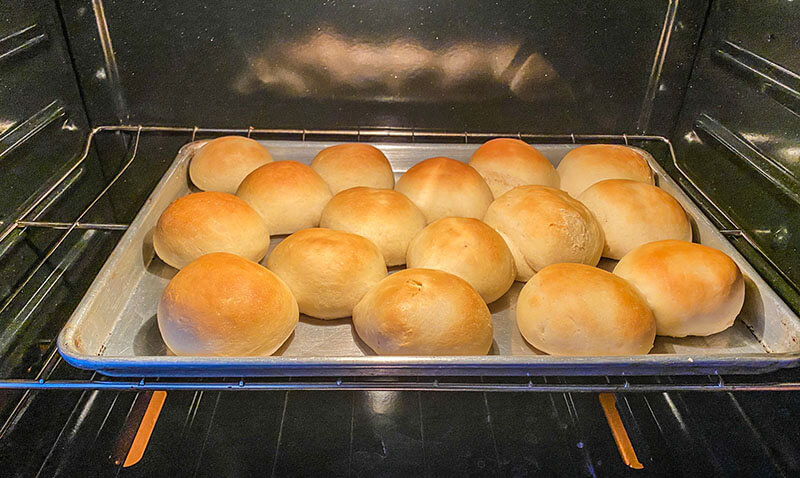 Dinner rolls are almost finished baking.